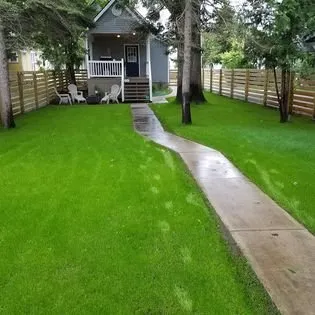 Trusted lawn mowing service in Traverse City, MI by Toms Total Outdoor Maintenance Service