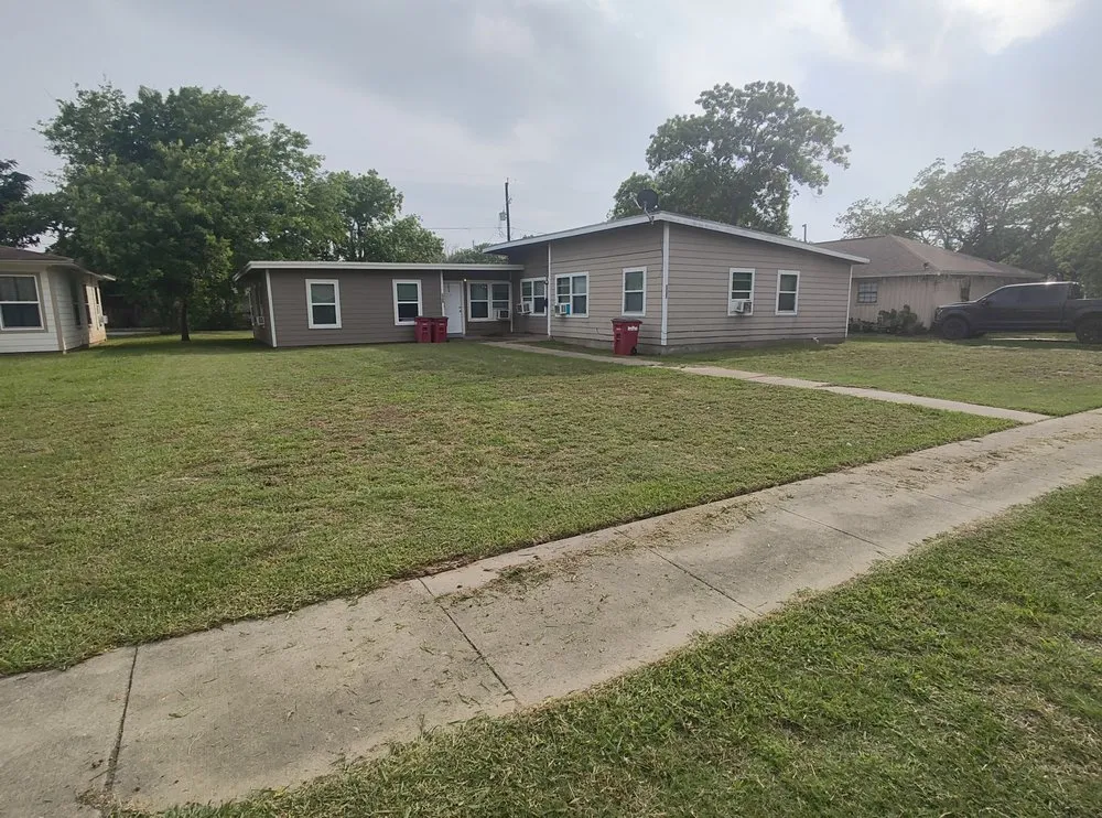 Professional yard cleanup service in Angleton, TX by Top Cut Lawn Care