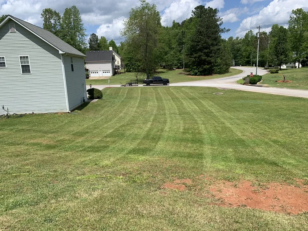 Top-rated lawn care service for year-round maintenance across Temple, GA - Top Cut Properties