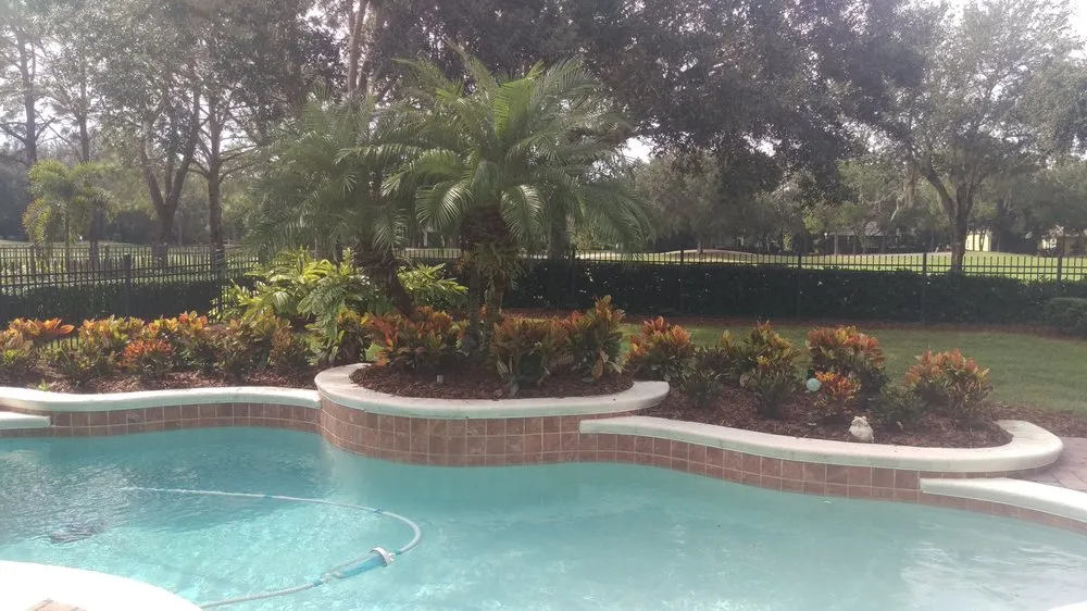 Custom outdoor landscaping with custom design in Windermere, FL by Top Gunn Lawn Care