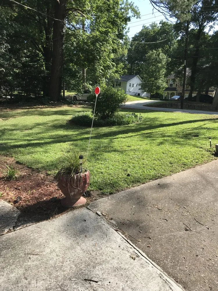Affordable lawn care service for residential properties in Atlanta, GA by Top Notch Landscaping and Pressure Washing