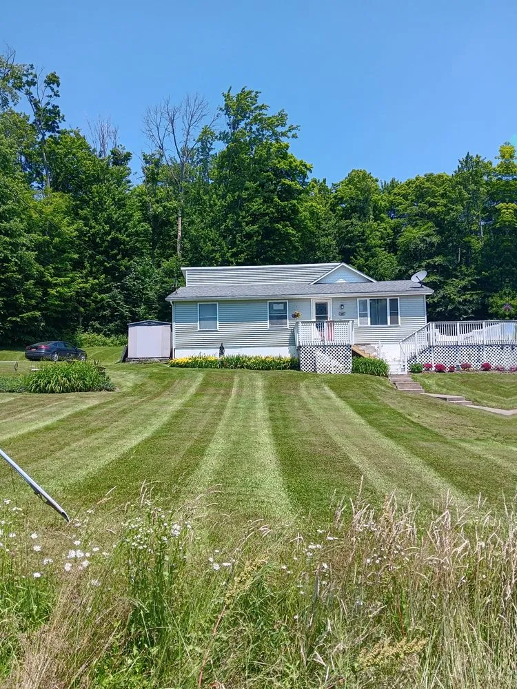 Custom landscaping services for beautiful yards in Maine, NY by Top Notch Landscaping