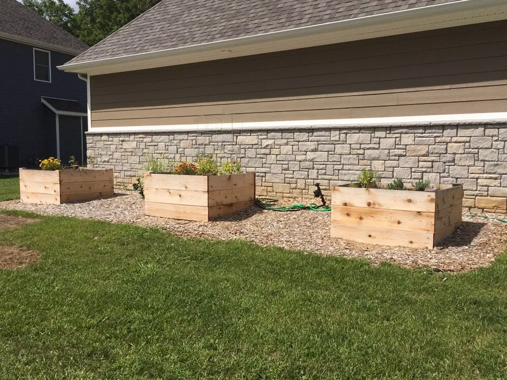 Affordable residential landscaping for year-round maintenance in Bloomington, IN by Top Notch Mowing and Landscapes