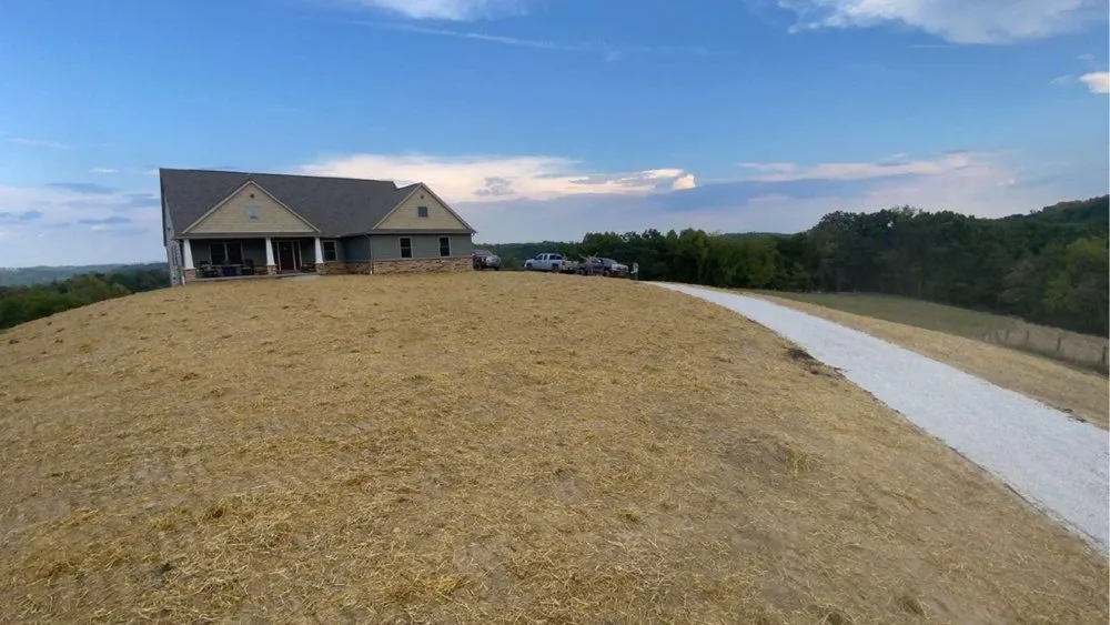 Reliable lawn mowing service for homes in Moundsville, WV by Top Performance Excavating