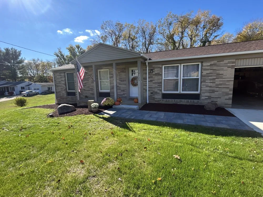 Professional lawn mowing service for residential properties in Massillon, OH by Top Tier Construction and Landscaping