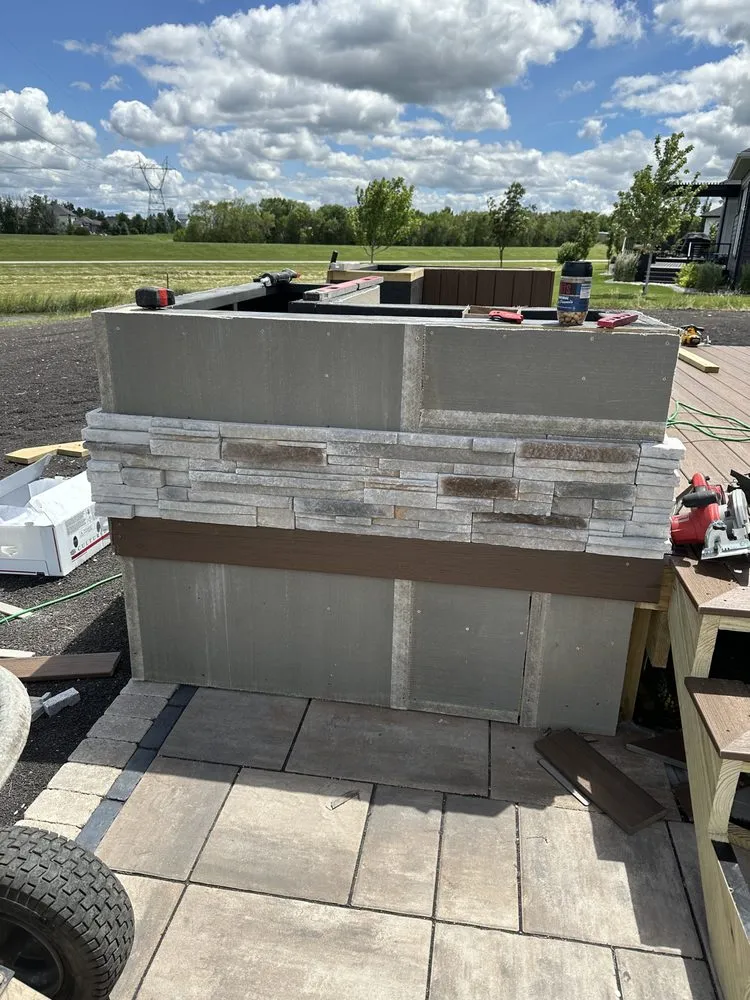 Expert lawn mowing service with custom design in West Fargo, ND by Top Tier Landscaping