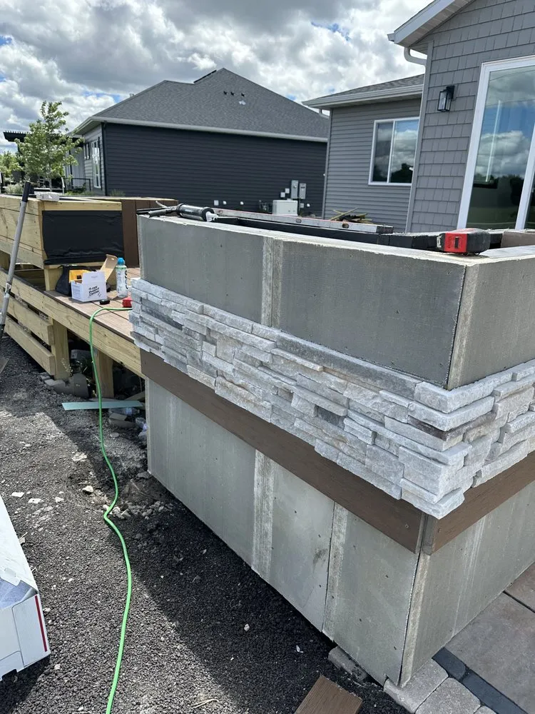 Professional landscape installation for year-round maintenance in West Fargo, ND by Top Tier Landscaping