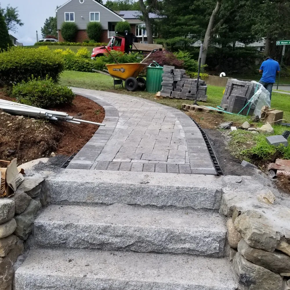Custom residential landscaping for year-round maintenance in Billerica, MA by Topping Landscaping
