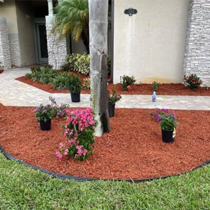 Local landscape design for year-round maintenance in Melbourne, FL by Tops Down Tree Service