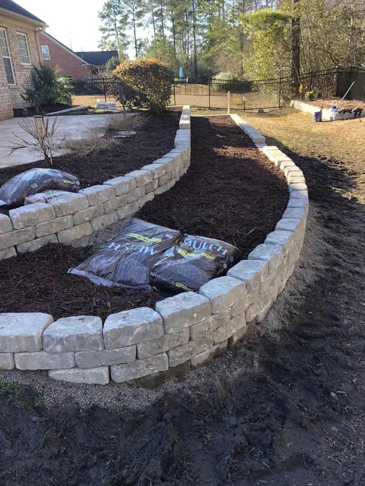 Reliable lawn care service in Hampstead, NC by Topsoil Top Dressings