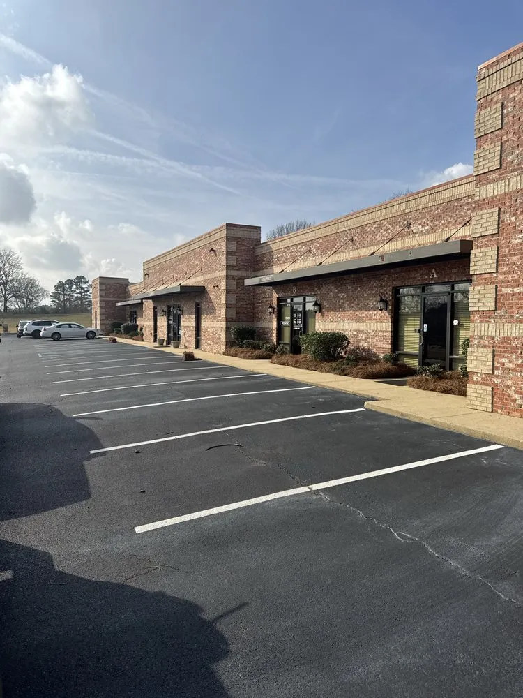 Expert lawn mowing service for residential properties in Raymond, MS by Total Lawn Care