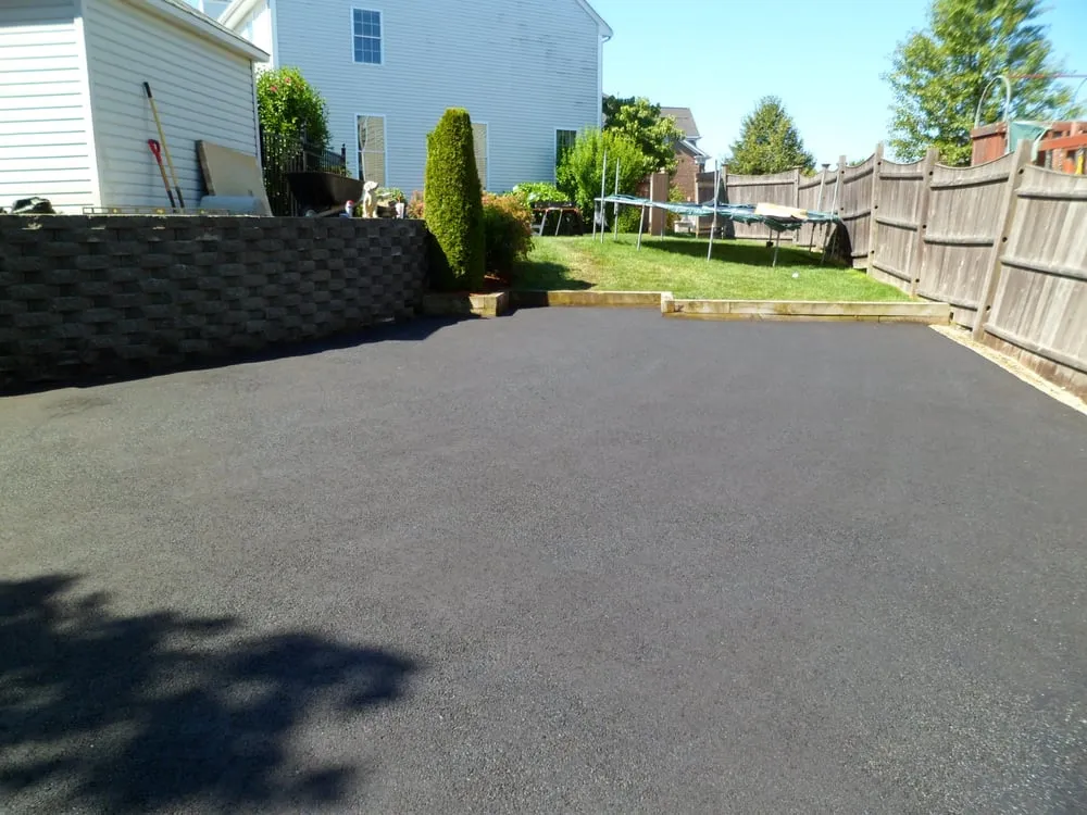 Custom yard cleanup service for residential properties in Stoneham, MA by Total Perfection Pavement