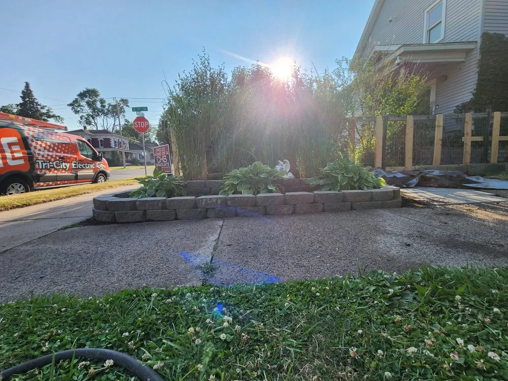 Affordable yard cleanup service for homes in Clinton, IA by Town & Country Mowing