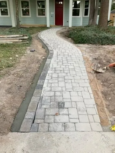 Professional landscape installation for residential properties in Conroe, TX by Tractor Work Landscaping Pros