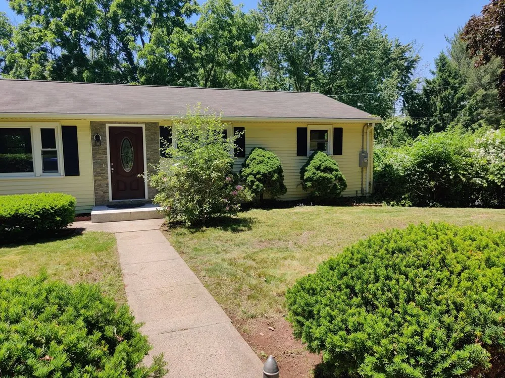 Custom landscape installation for year-round maintenance in New Britain, CT by Tramonto Bello