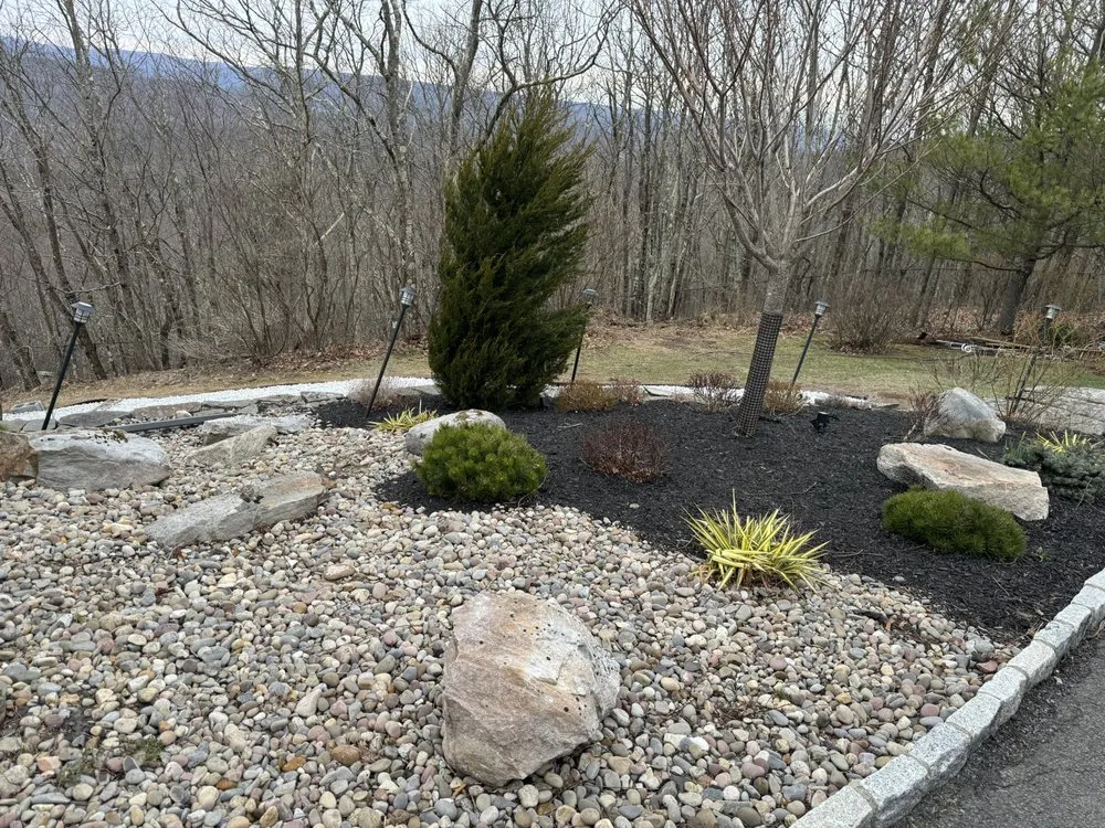Local lawn care service for year-round maintenance in Port Jervis, NY by Triscape