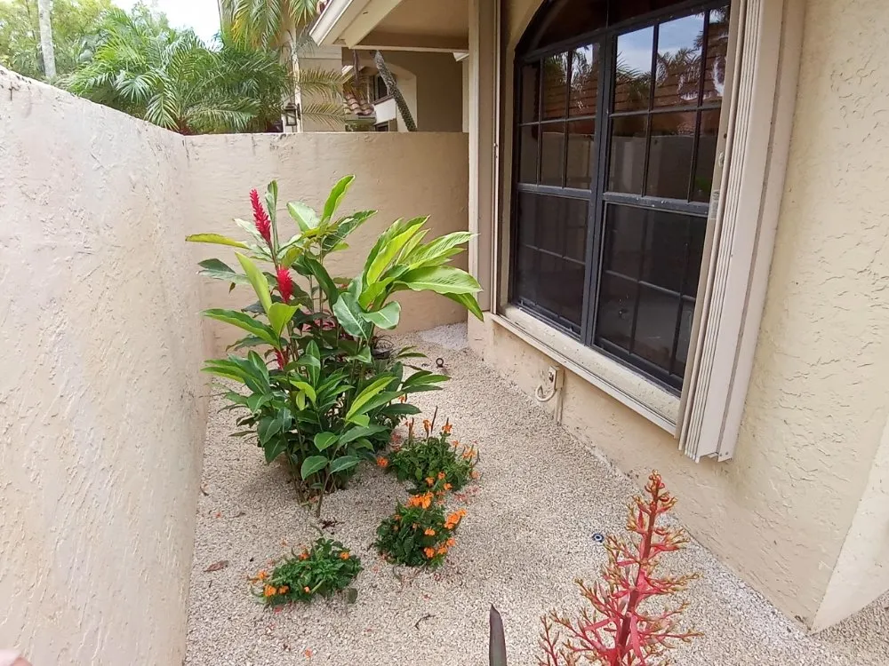 Affordable residential landscaping for year-round maintenance in Port St. Lucie, FL by Triumph Forces Lawn Maintenance and Irrigation