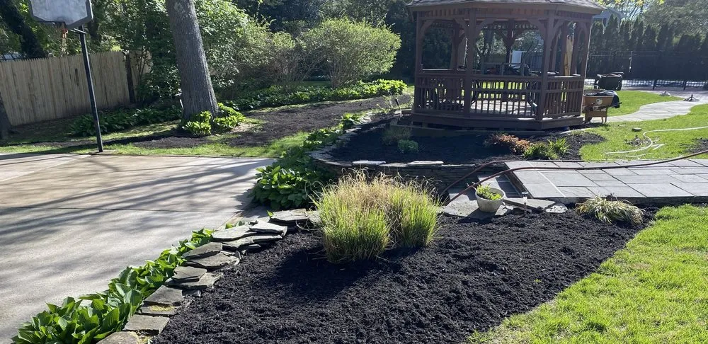 Custom landscape installation with custom design across East Northport, NY - Tromblee Property Services