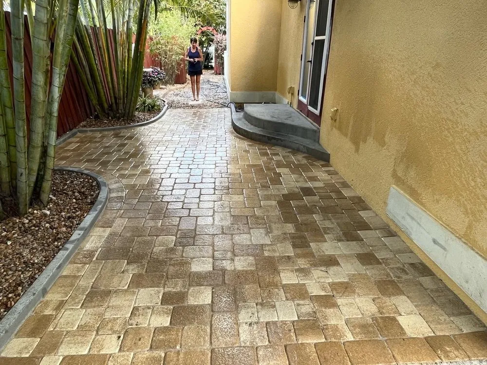 Affordable lawn mowing service for year-round maintenance in Vero Beach, FL by Tropical Hardscapes