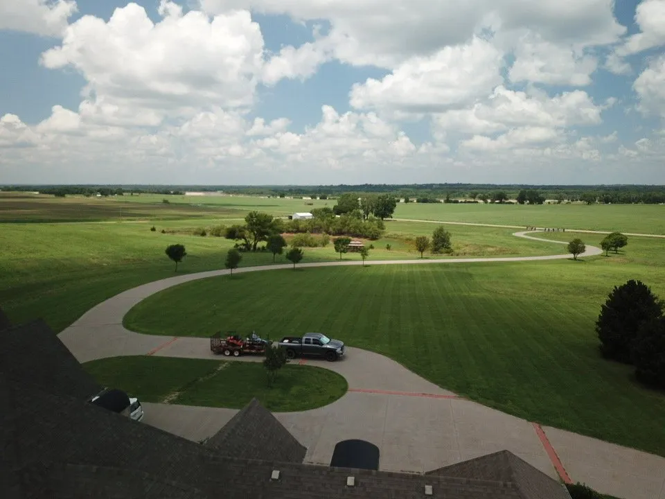 Affordable landscape installation with custom design in Stillwater, OK by Tropics Mowing