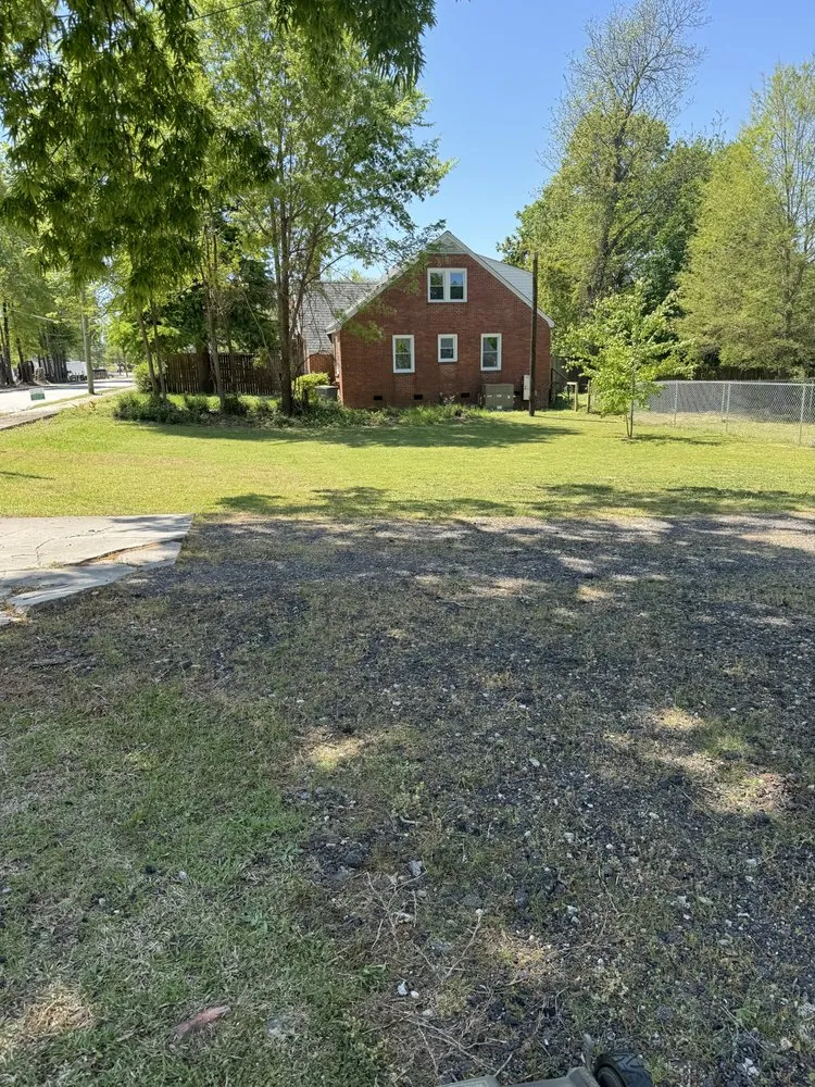 Professional lawn care service for residential properties in Clinton, SC by Trotters Handy Services