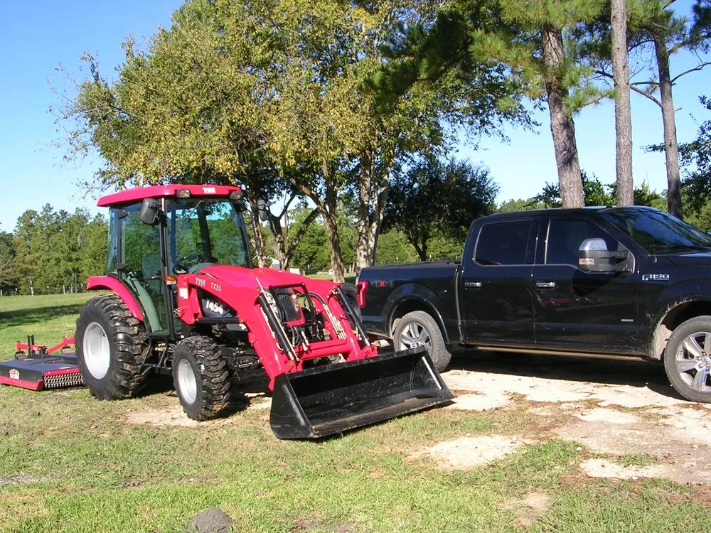 Affordable landscape installation experts serving Montgomery, TX - Truck and tractor for hire