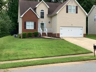 Trust Lawn Care Logo