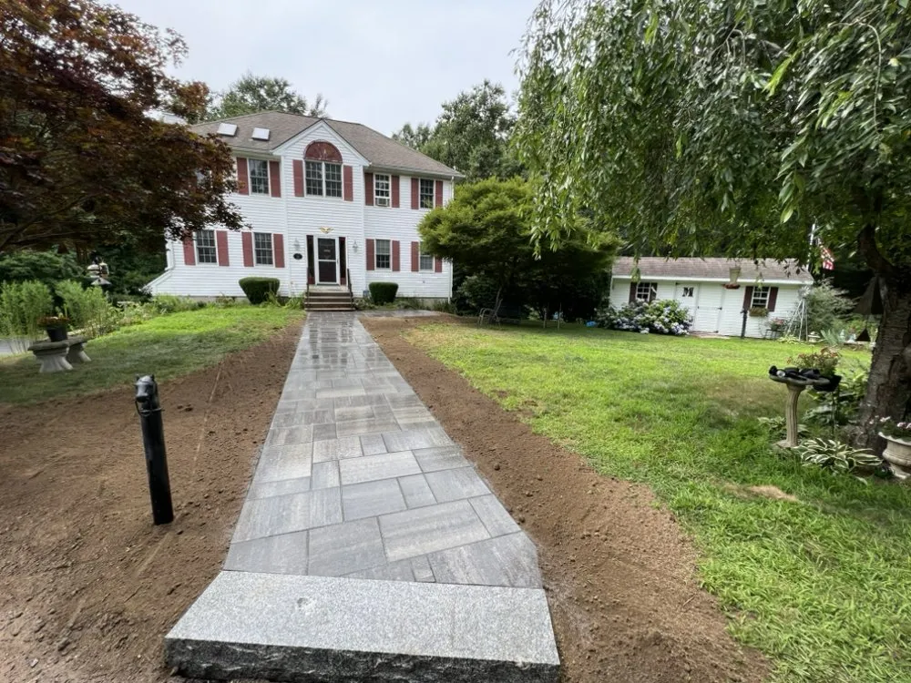 Trusted outdoor landscaping for residential properties in Uxbridge, MA by T'S Lawn Care & Stump Grinding