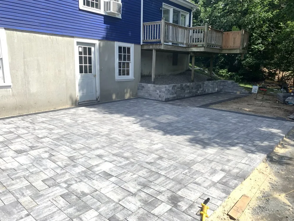 Local landscaping services for year-round maintenance in Uxbridge, MA by T'S Lawn Care & Stump Grinding