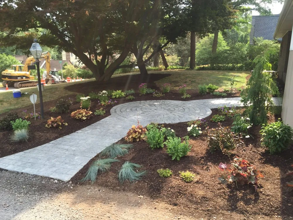 Affordable lawn care service for outdoor upgrades across Rochester, NY - Tschanz Landscape Service