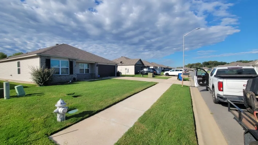 Custom landscape installation for year-round maintenance in Hensley, AR by Turf Hawg