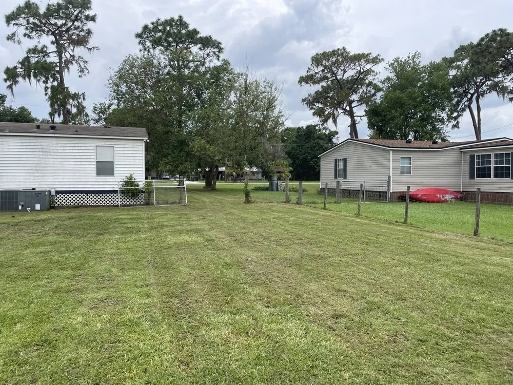 Professional lawn mowing service for residential properties in Lakeland, FL by Turf Masters Environmental