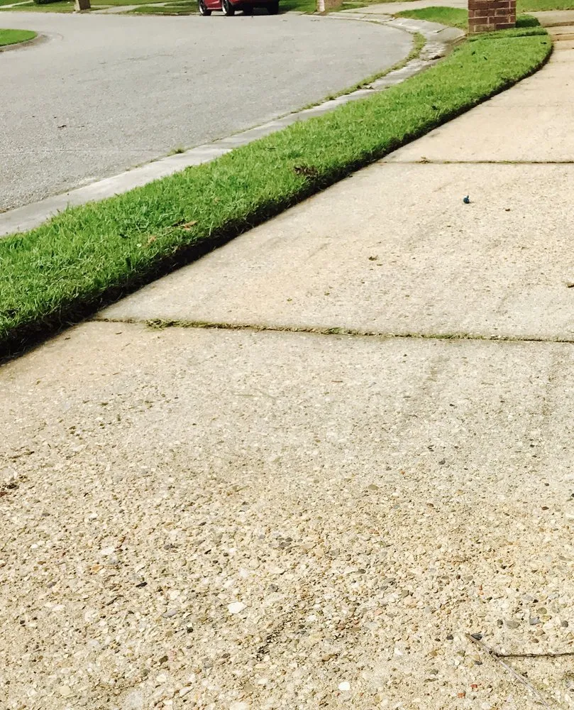 Custom lawn care service for homes in Ocean Springs, MS by Turf Surfers