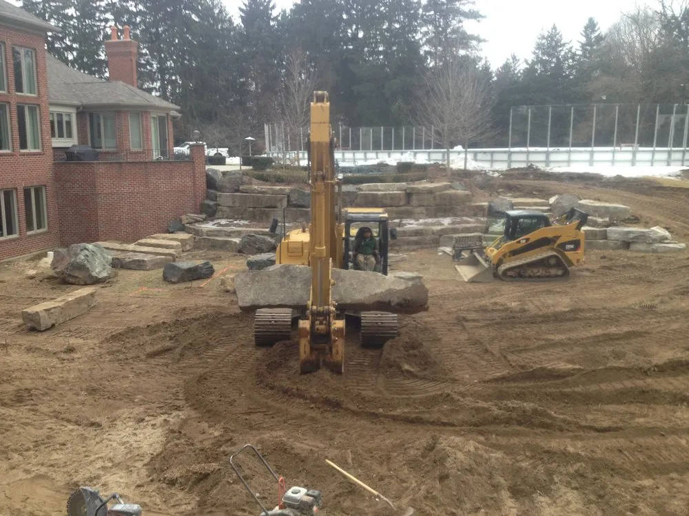 Expert yard maintenance for residential properties in Troy, MI by Twin Pines Landscaping