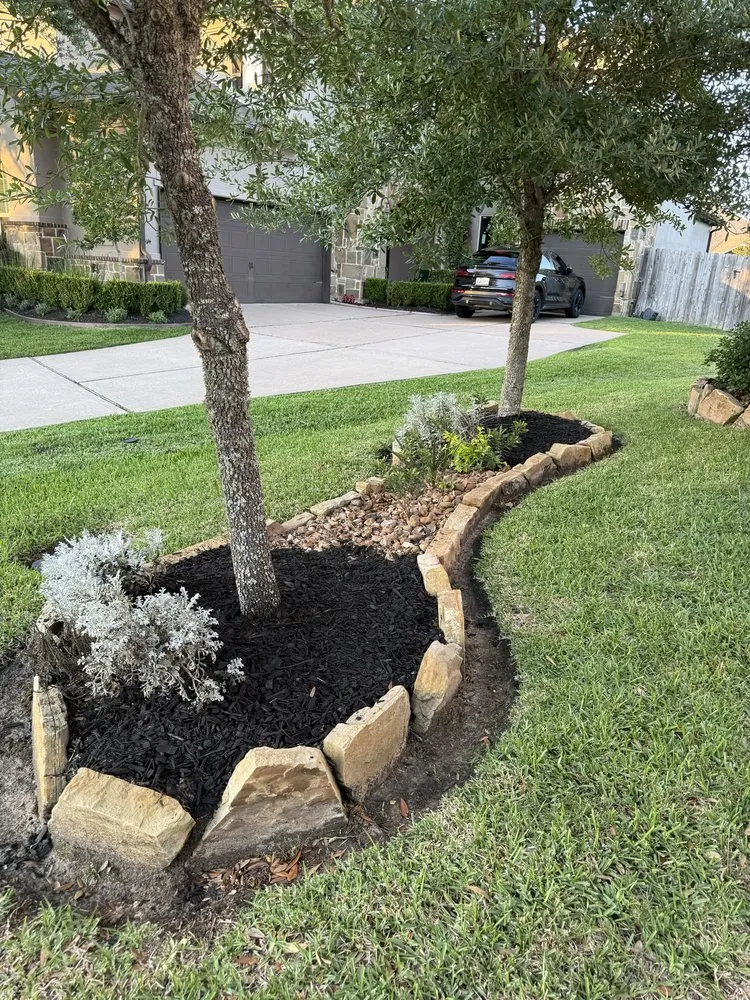 Professional yard maintenance with custom design in Friendswood, TX by Twisted Landscaping