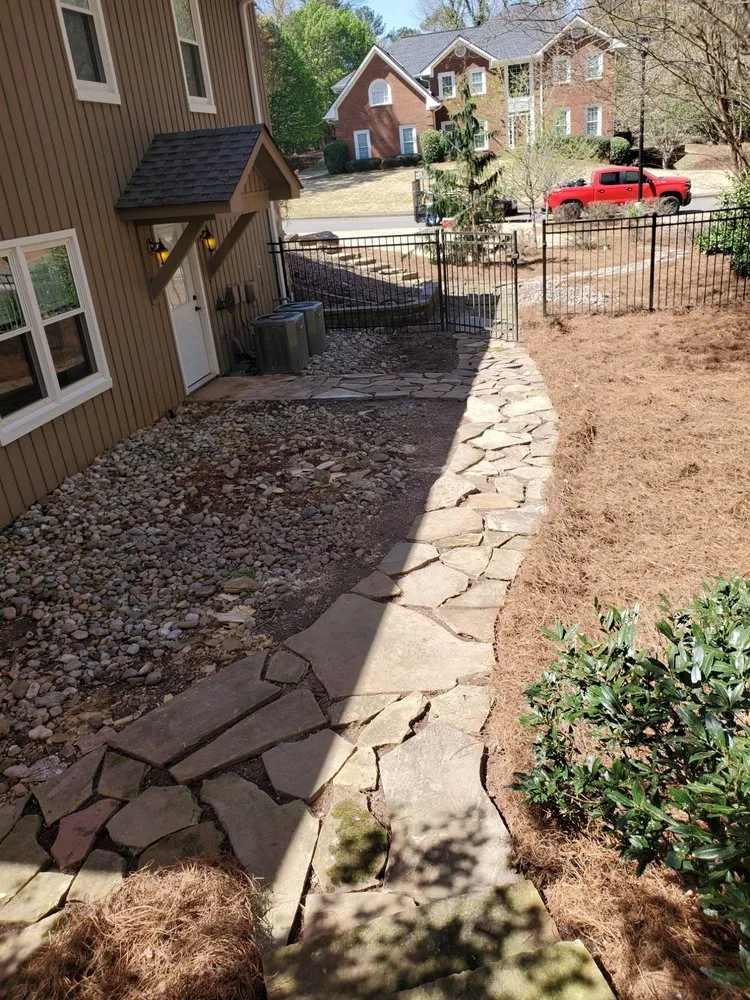 Professional yard cleanup service for residential properties in Marietta, GA by Two Brothers Tree Service and Landscaping