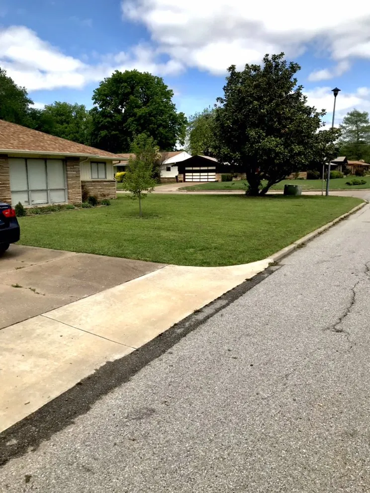 Expert lawn mowing service for residential properties across Mounds, OK - Two Feathers lawn and outdoors