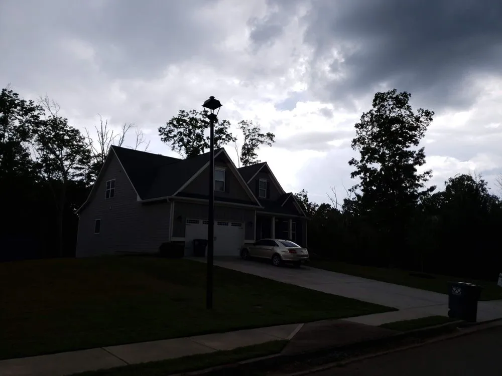 Custom garden landscaping for residential properties across Adairsville, GA - Two men and a mower