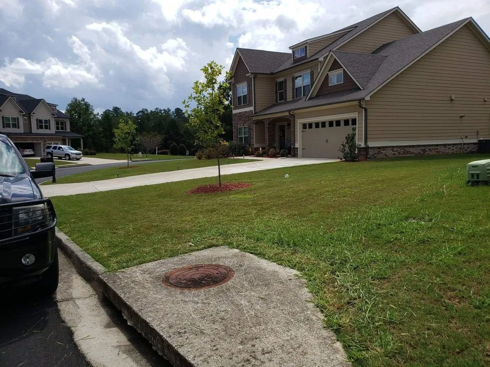 Professional residential landscaping near you in Adairsville, GA by Two men and a mower