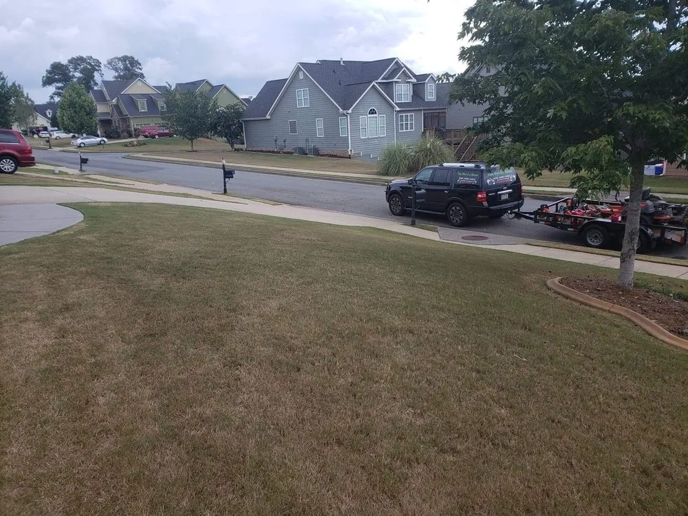 Expert lawn mowing service in Adairsville, GA by Two men and a mower