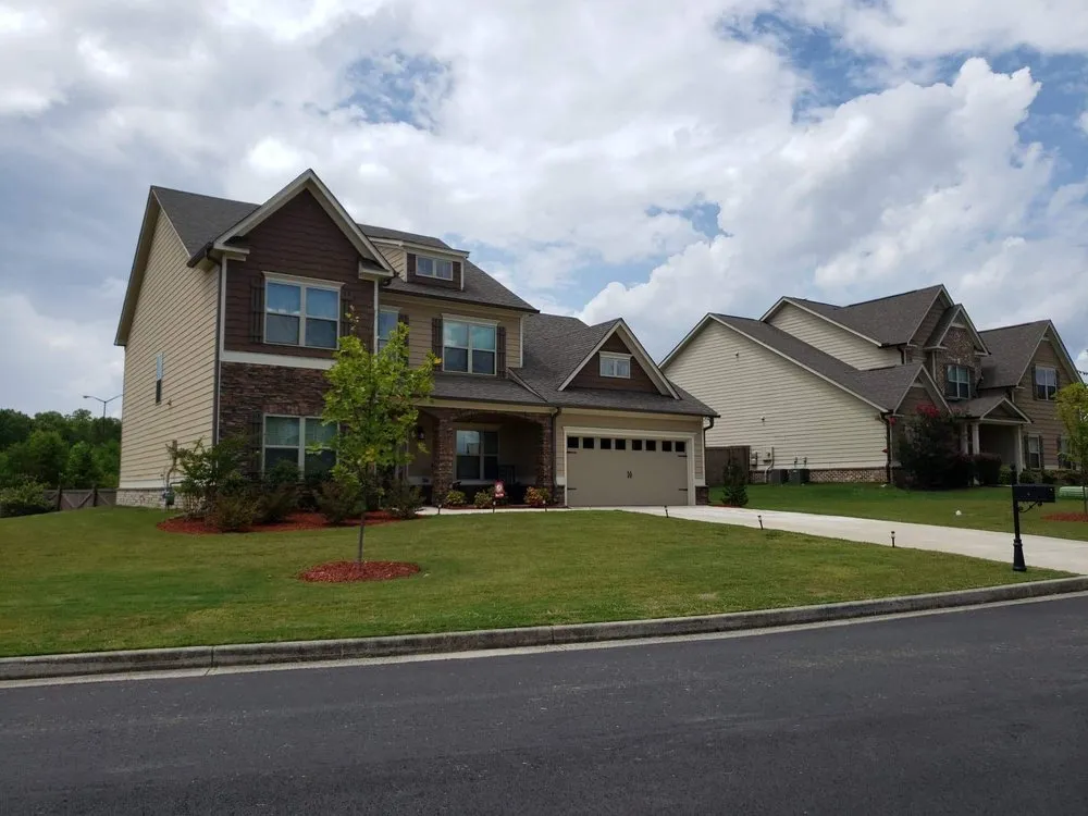 Affordable landscape design in Adairsville, GA - Two men and a mower