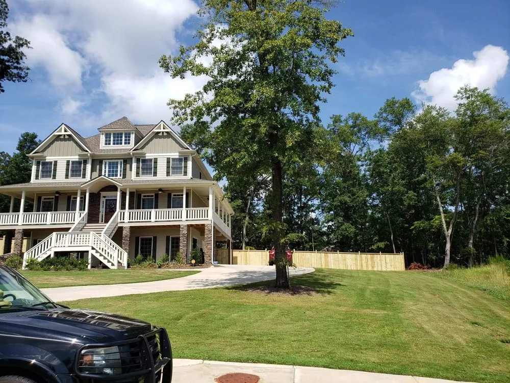 Local outdoor landscaping for residential properties across Adairsville, GA - Two men and a mower