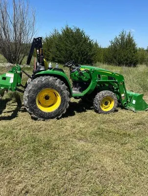 Two Men and A Tractor Logo