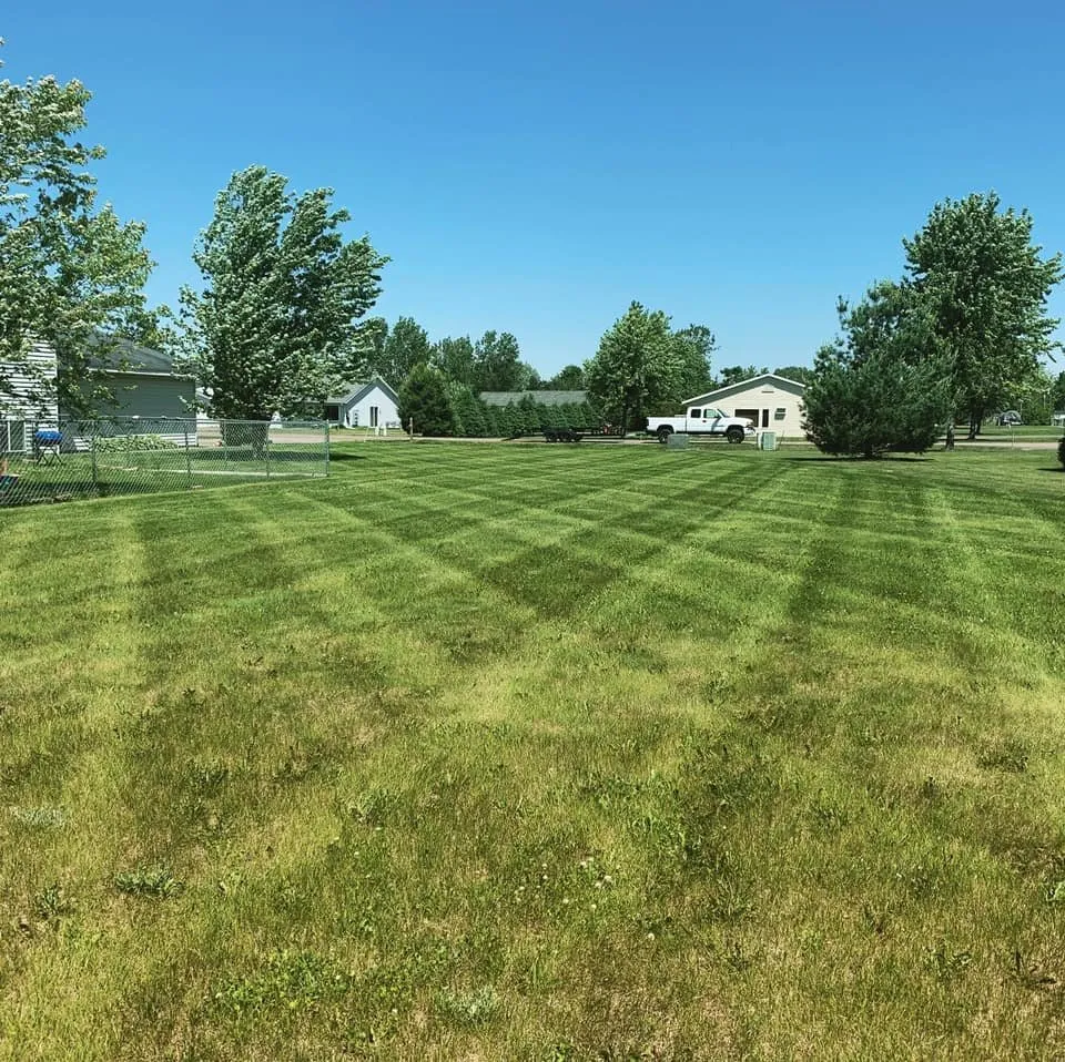 Reliable lawn mowing service for year-round maintenance in Eau Claire, WI by Two Rivers Lawn & Landscape