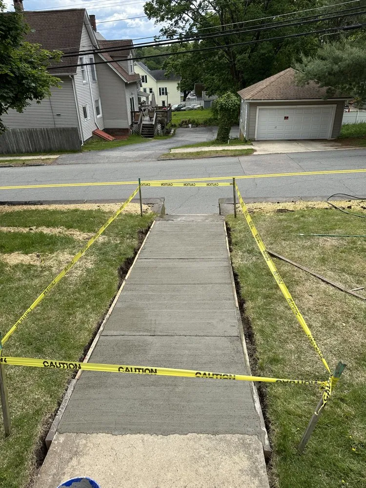 Custom landscape installation with custom design in North Franklin, CT by Tylers Property Maintenance