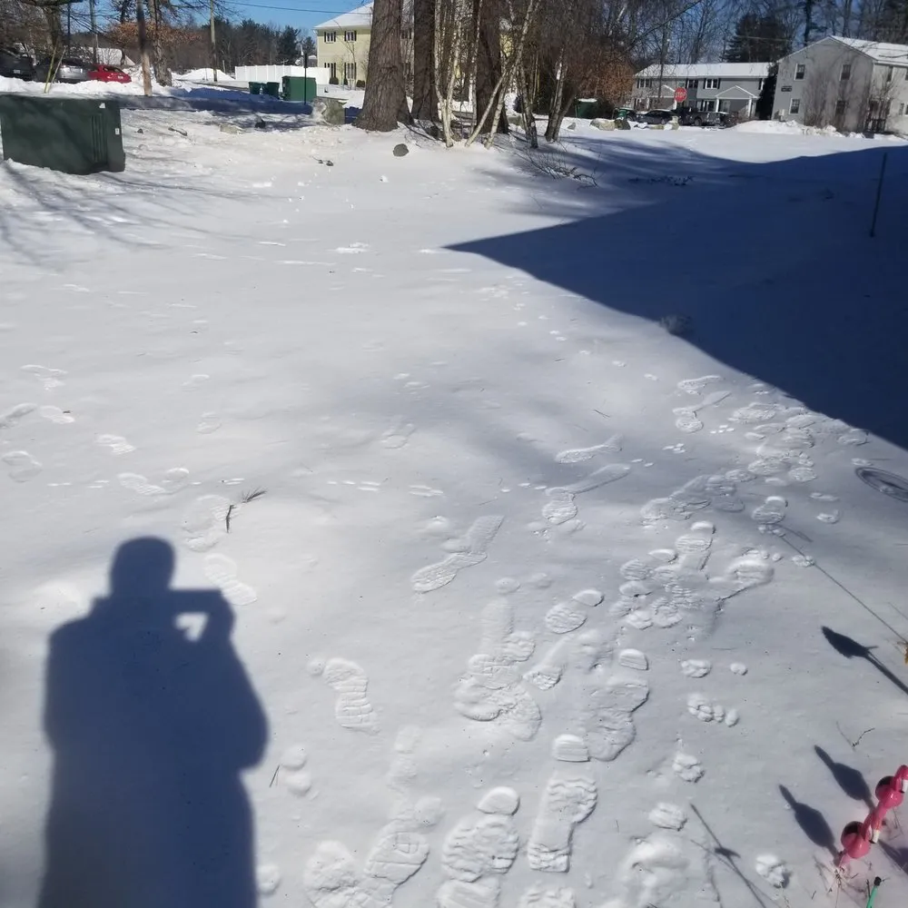 Affordable lawn mowing service for year-round maintenance across Bedford, NH - Ulster Property Services