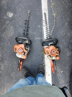 Undercuts lawn care and property services Logo