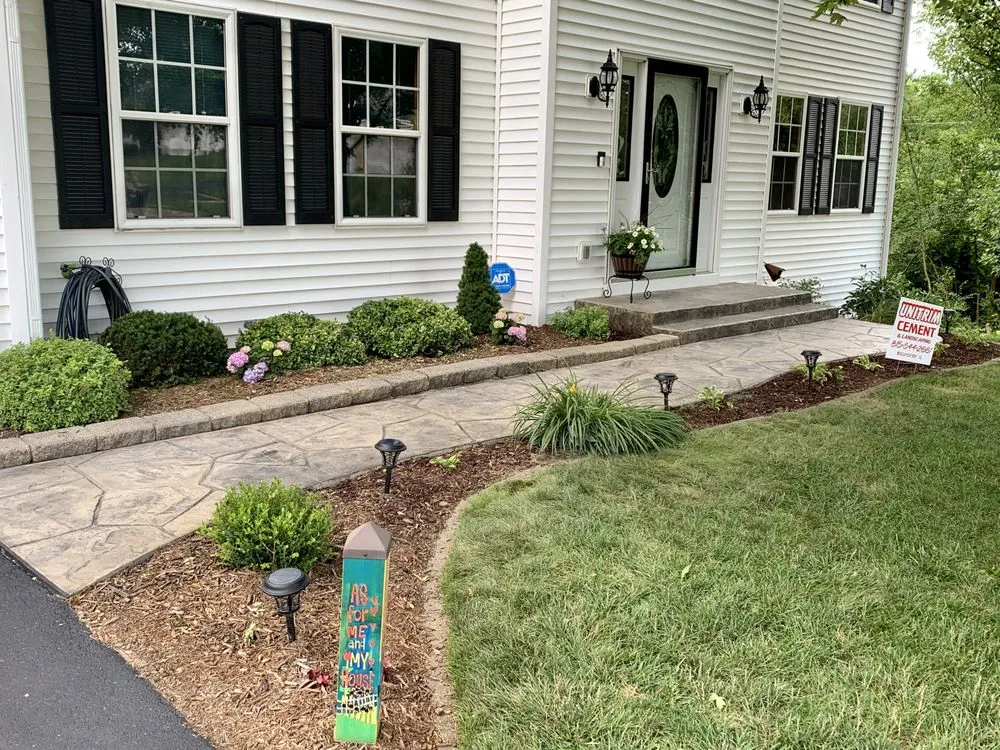 Custom landscape installation for residential properties in Belvidere, IL by Unitrim Cement & Landscaping