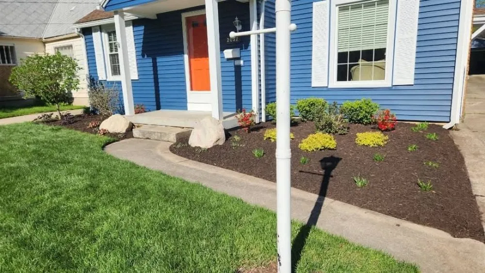 Professional outdoor landscaping for homes in Belding, MI by Upstream Landscape Maintenance and Design