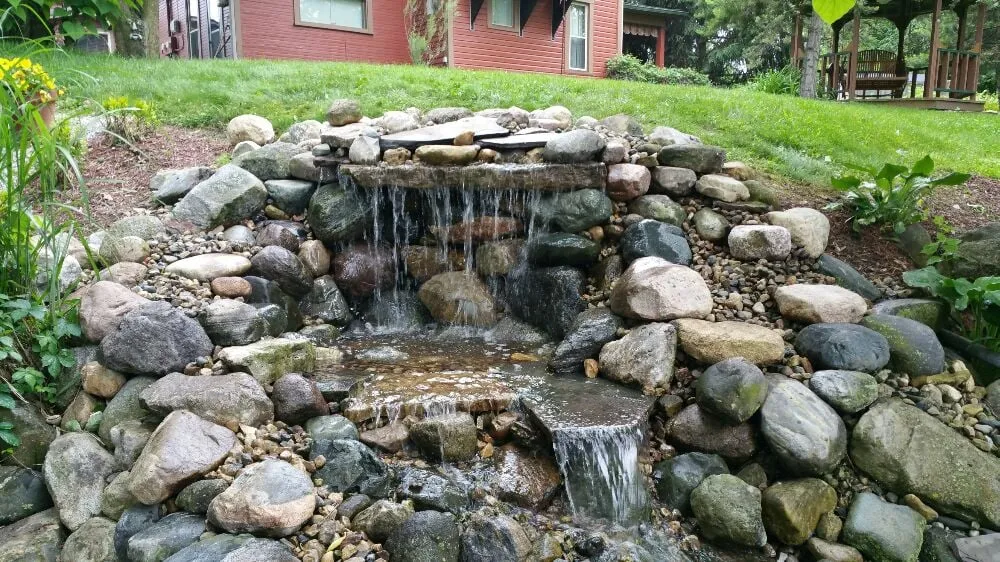 Professional yard cleanup service with custom design in Noblesville, IN by Utopia Watergardens